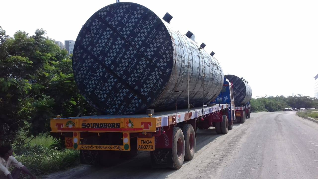 Large cylindrical vessel loaded on an MMM trailer at the roadside